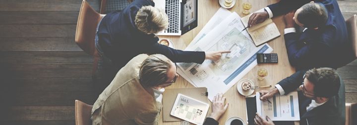 A marketing team is having a meeting in a conference room.