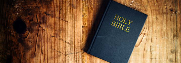 Picture of Holy Bible on a wood table