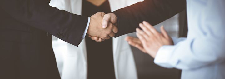 two businessmen shaking hands