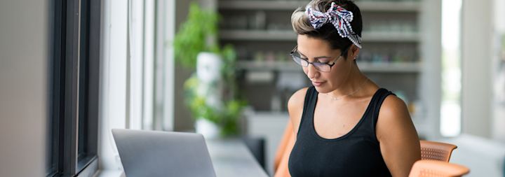 a woman studying on her computer