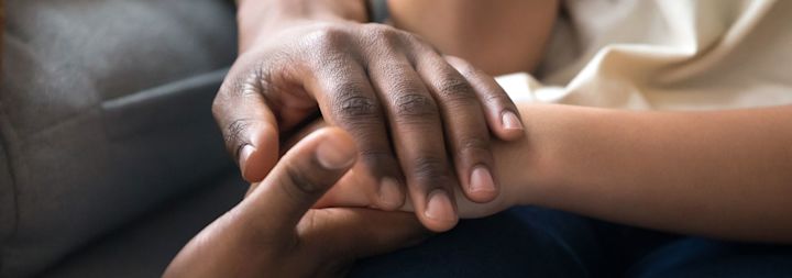 a family holding hands