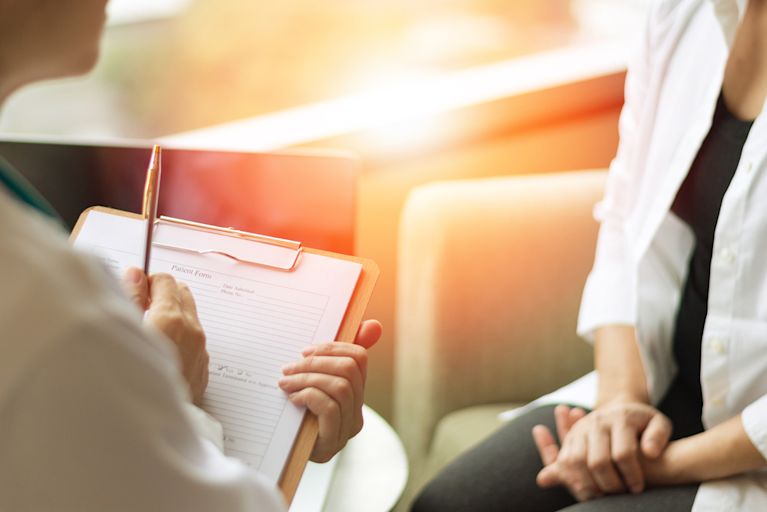 A professional counseling is having a counseling session with a patient.