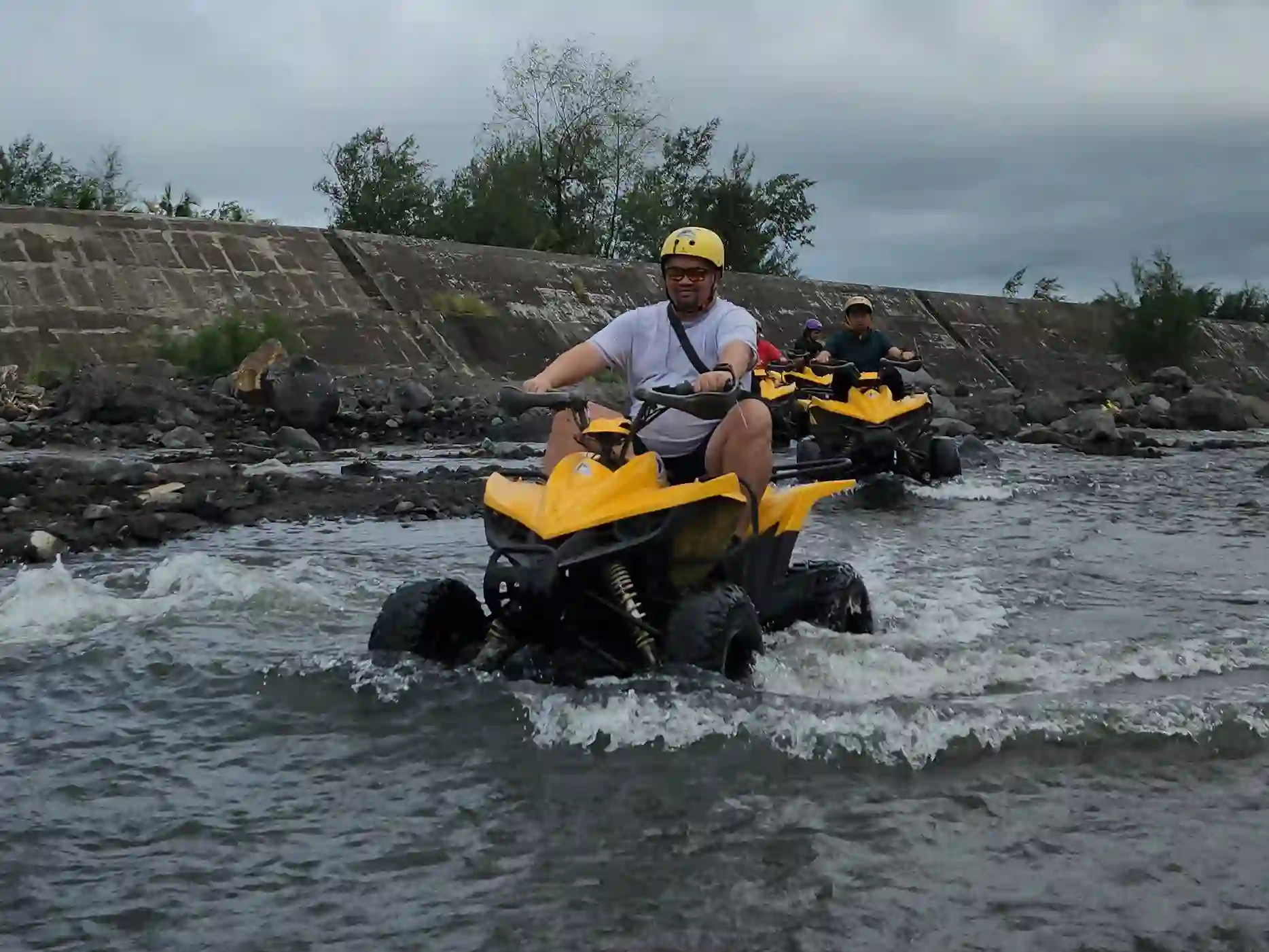 Alain Bibera captured with DJI Osmo Action 5 Pro during an ATV ride across green lava terrain showing rugged outdoor conditions