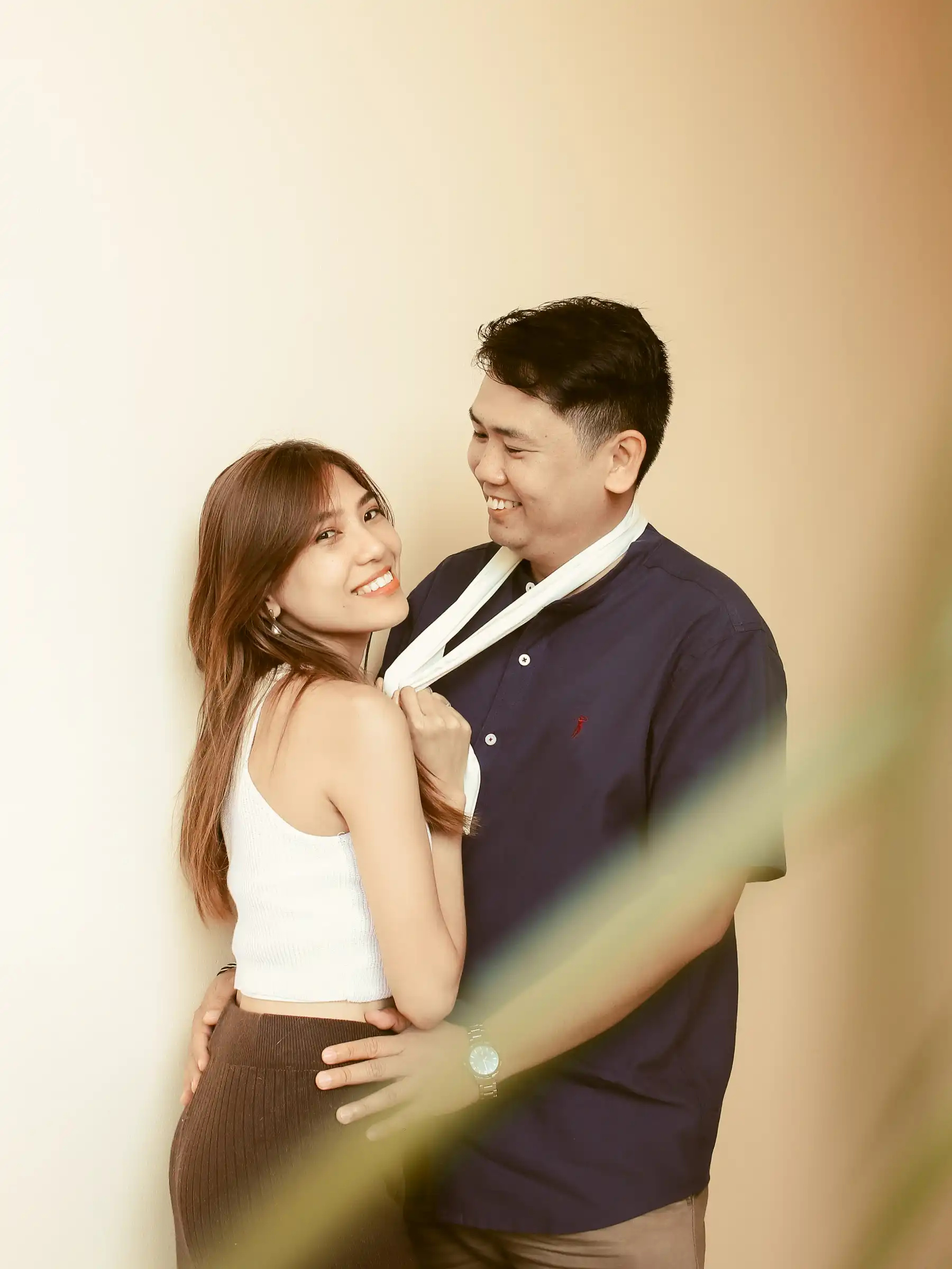 Judy Ann and Ryan Lester Celorico embracing and smiling at each other inside the mall at Southwoods Alabang