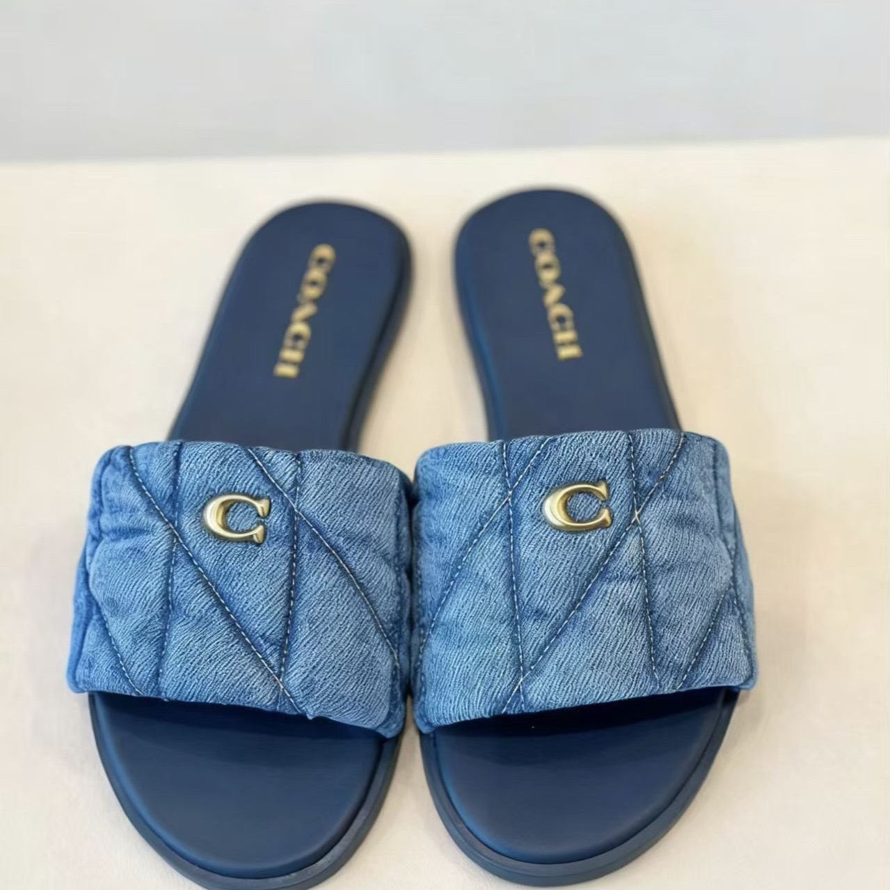 Coach slippers - China Import to Ghana