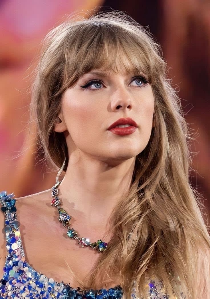 Taylor Swift live on stage during The Eras Tour in sparkling bodysuit