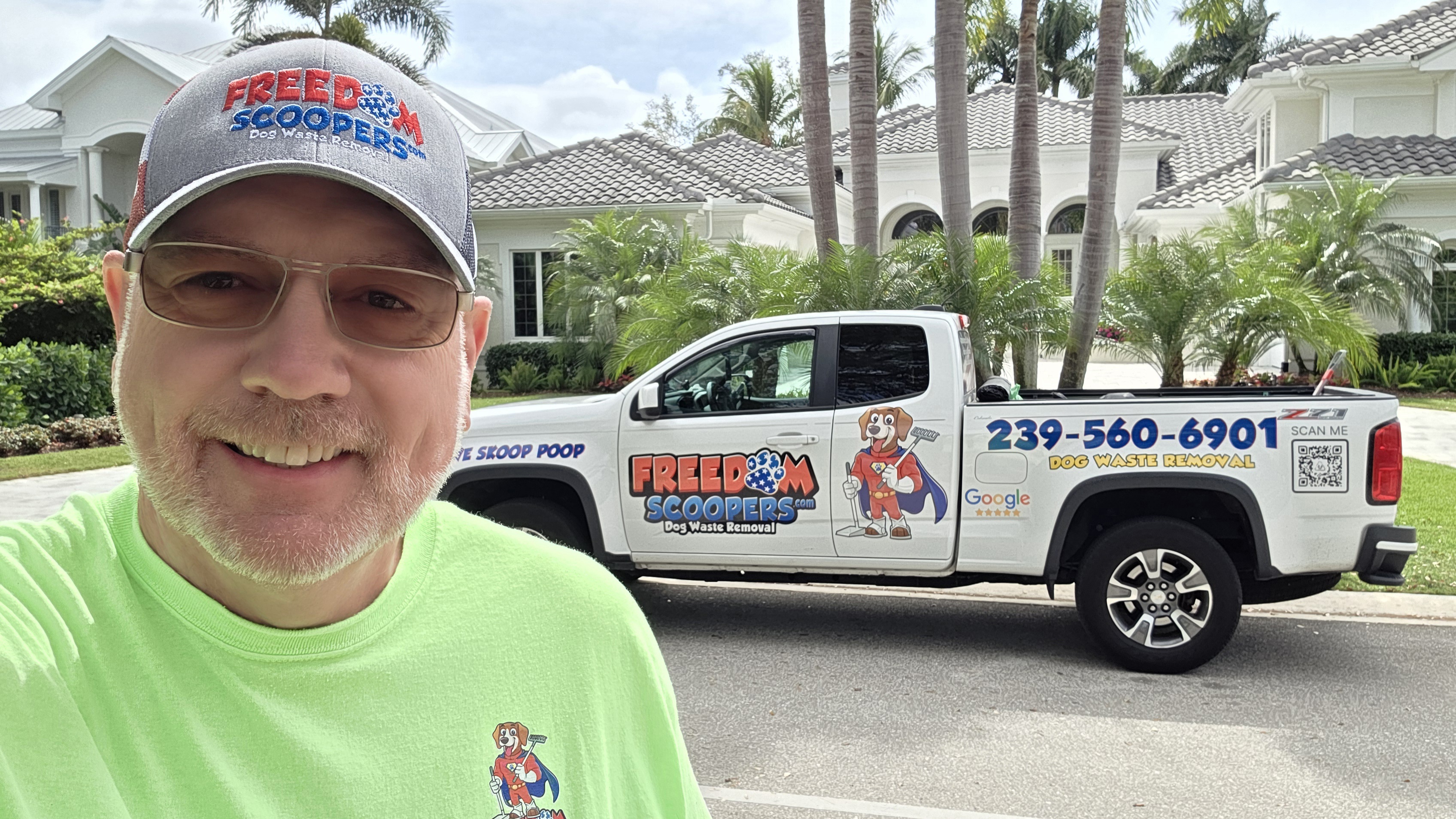 Freedom Scoopers wrapped service truck on a Lee County route