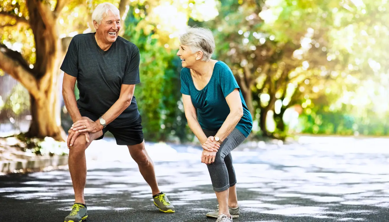 An elderly couple exercising outdoors, representing a long-term goal that strengthens trust and commitment in a long-distance relationship.