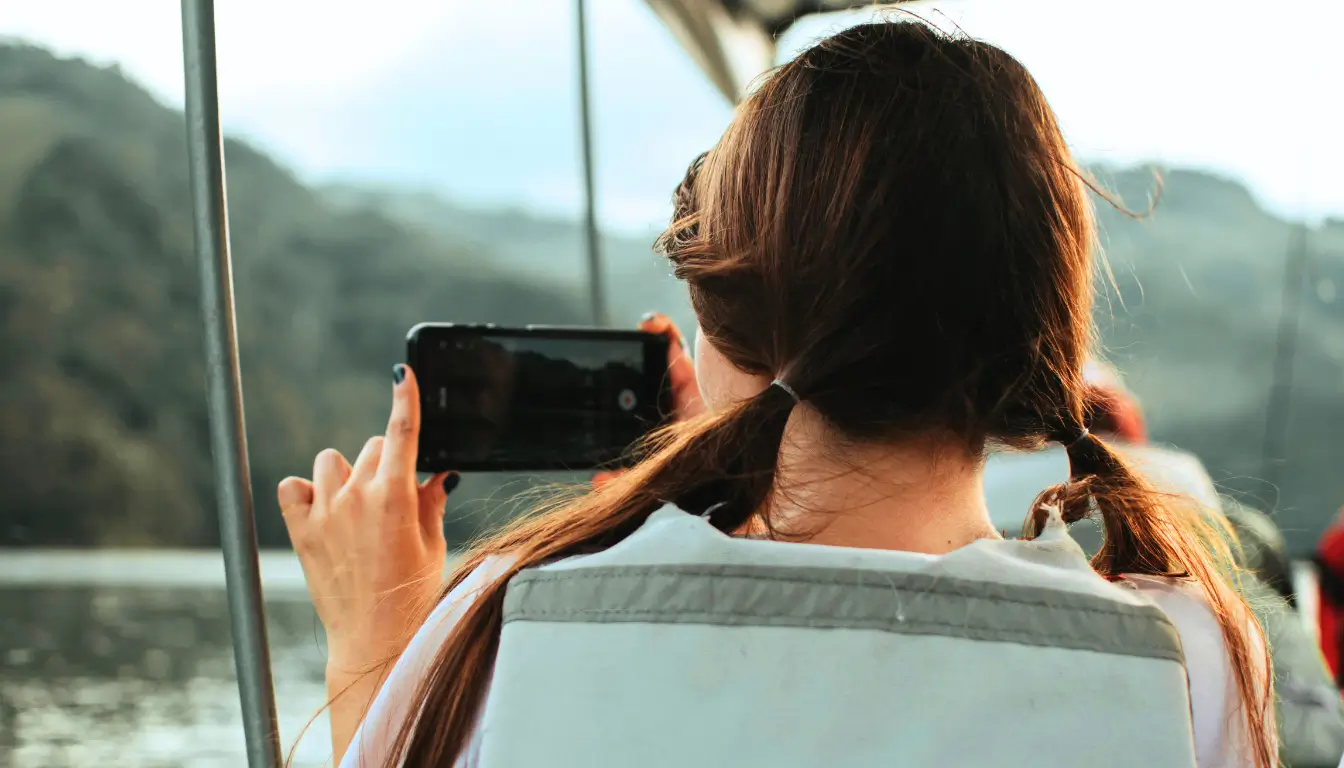 Woman recording a video of her surroundings to share a virtual tour with her long-distance partner.