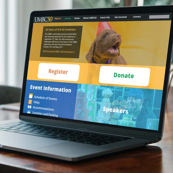 An open laptop with the UMBC50 homepage on the screen