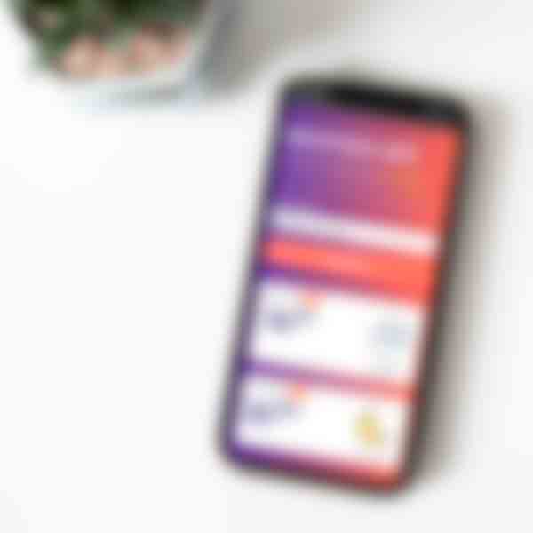 Picture of a phone on a counter, with the weather app open