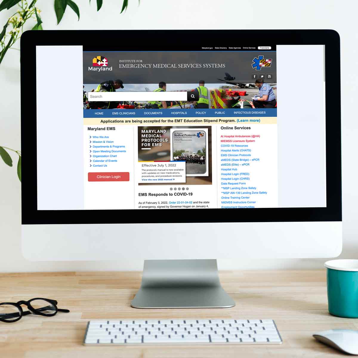 A desktop MAC monitor with the Maryland EMS homepage on display