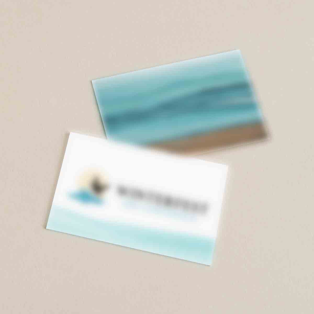 Two cards; the front card has the logo for Winterfest on it with watercolor waves underneath. The back card has the ocean painted with watercolors