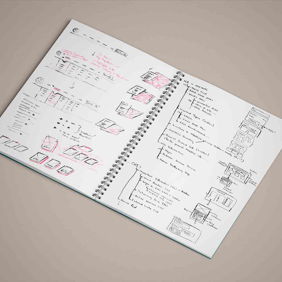 A second open sketch book with initial sketches of components and text treatments for the website
