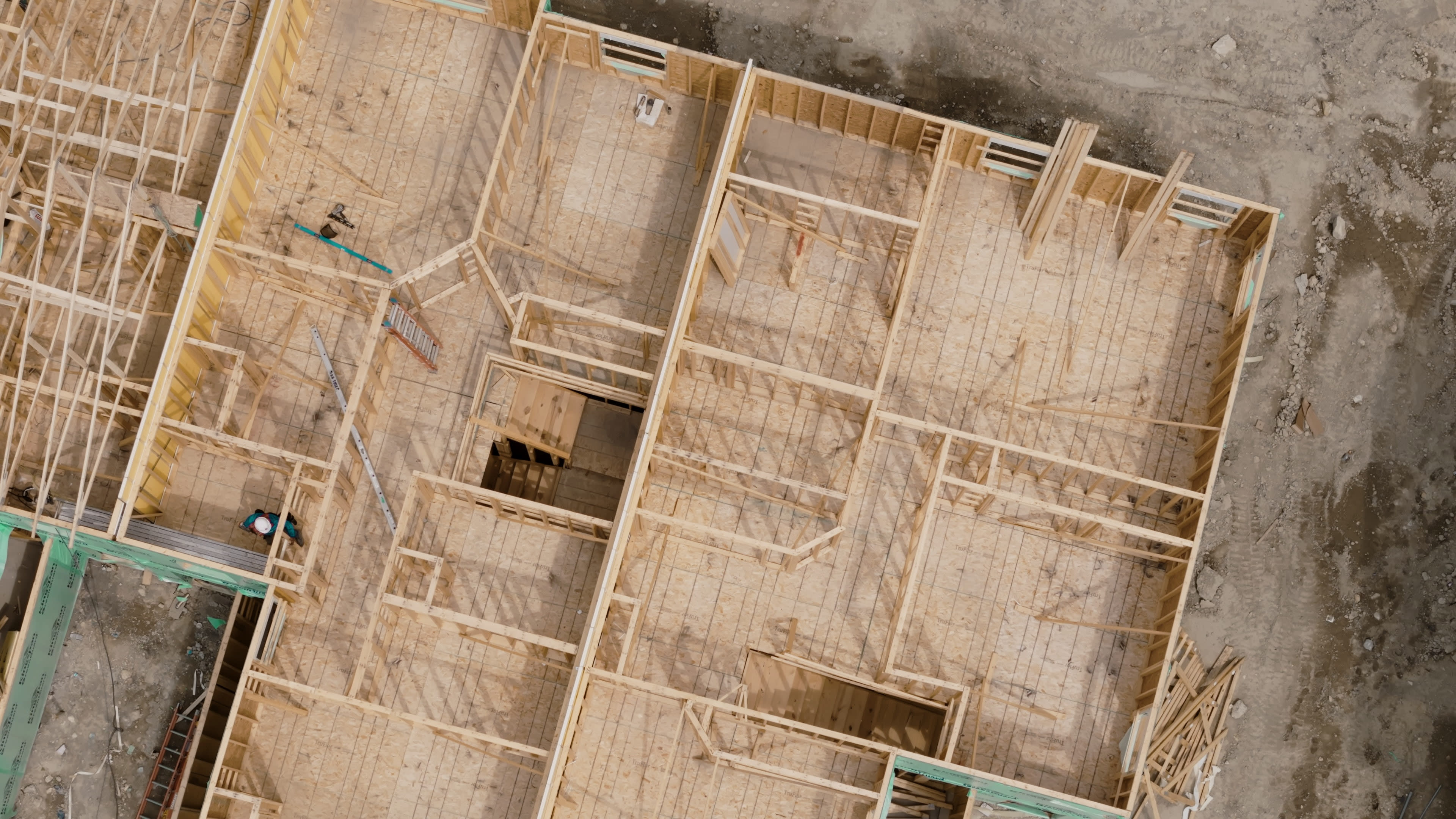 Construction of house wooden frame of family construction site aerial above footage