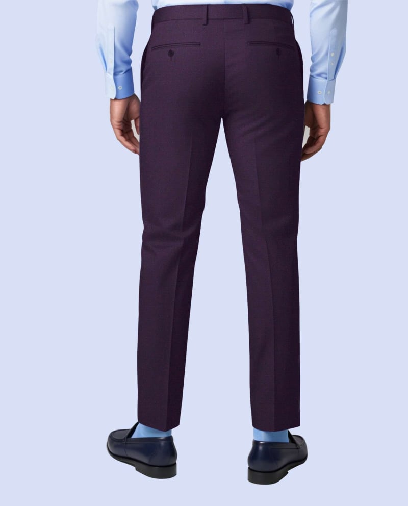 Close-up of royal purple tailored suit trousers with sharp crease line, clean front finish, and sleek formal silhouette.