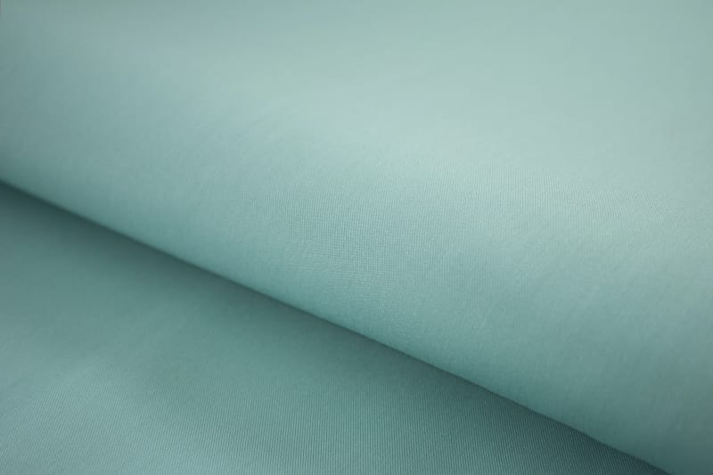 Close-up of teal blue premium cotton shirt texture