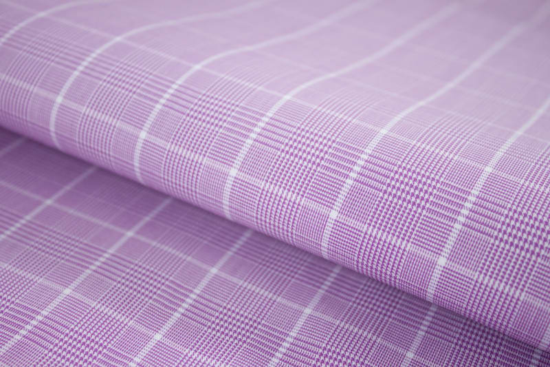 Fine weave detail of lavender check cotton dress shirt fabric with windowpane pattern