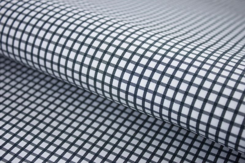Detailed texture of midnight black grid check cotton shirting fabric