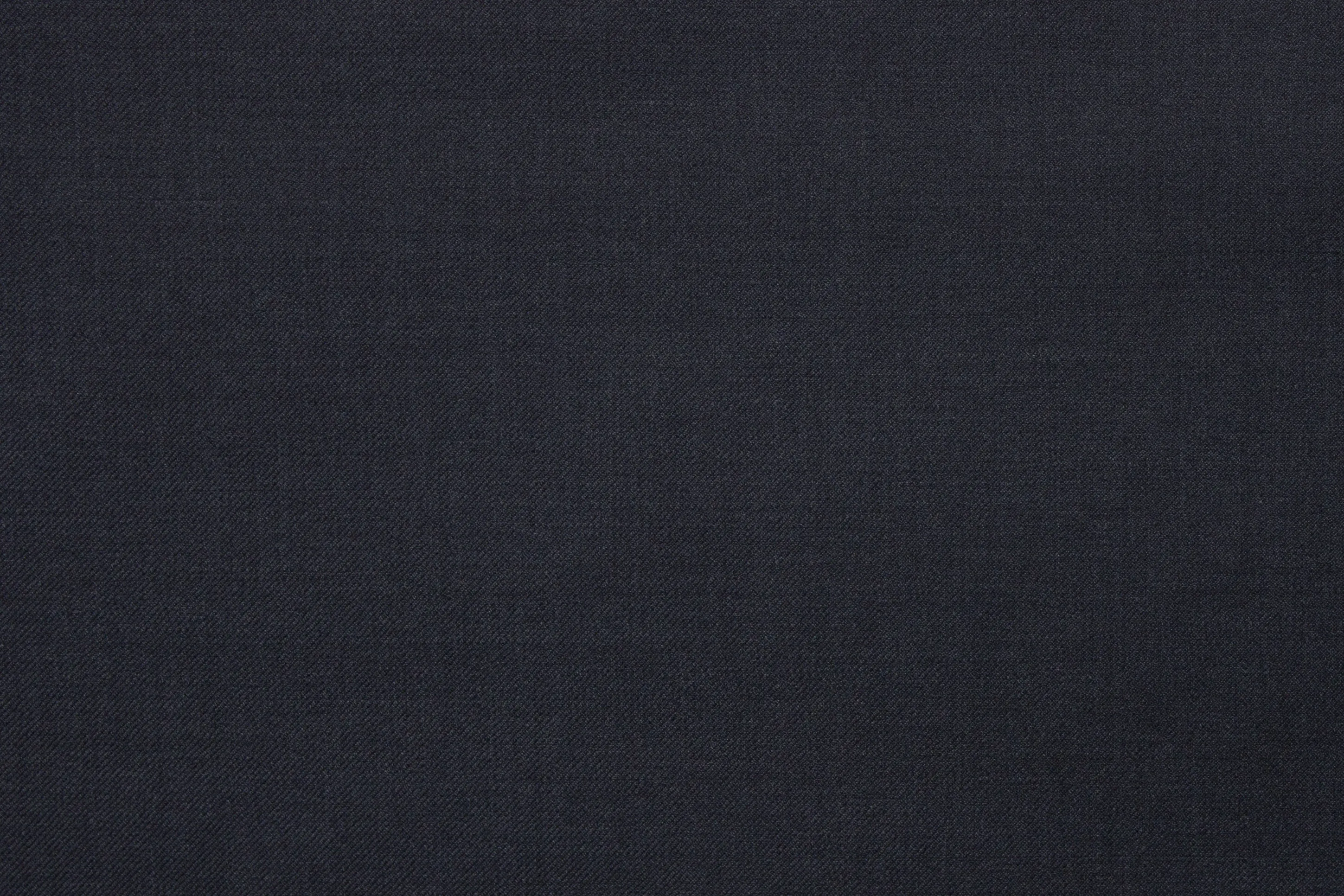 Close-up of navy Super 120’s wool suit fabric with fine textured weave