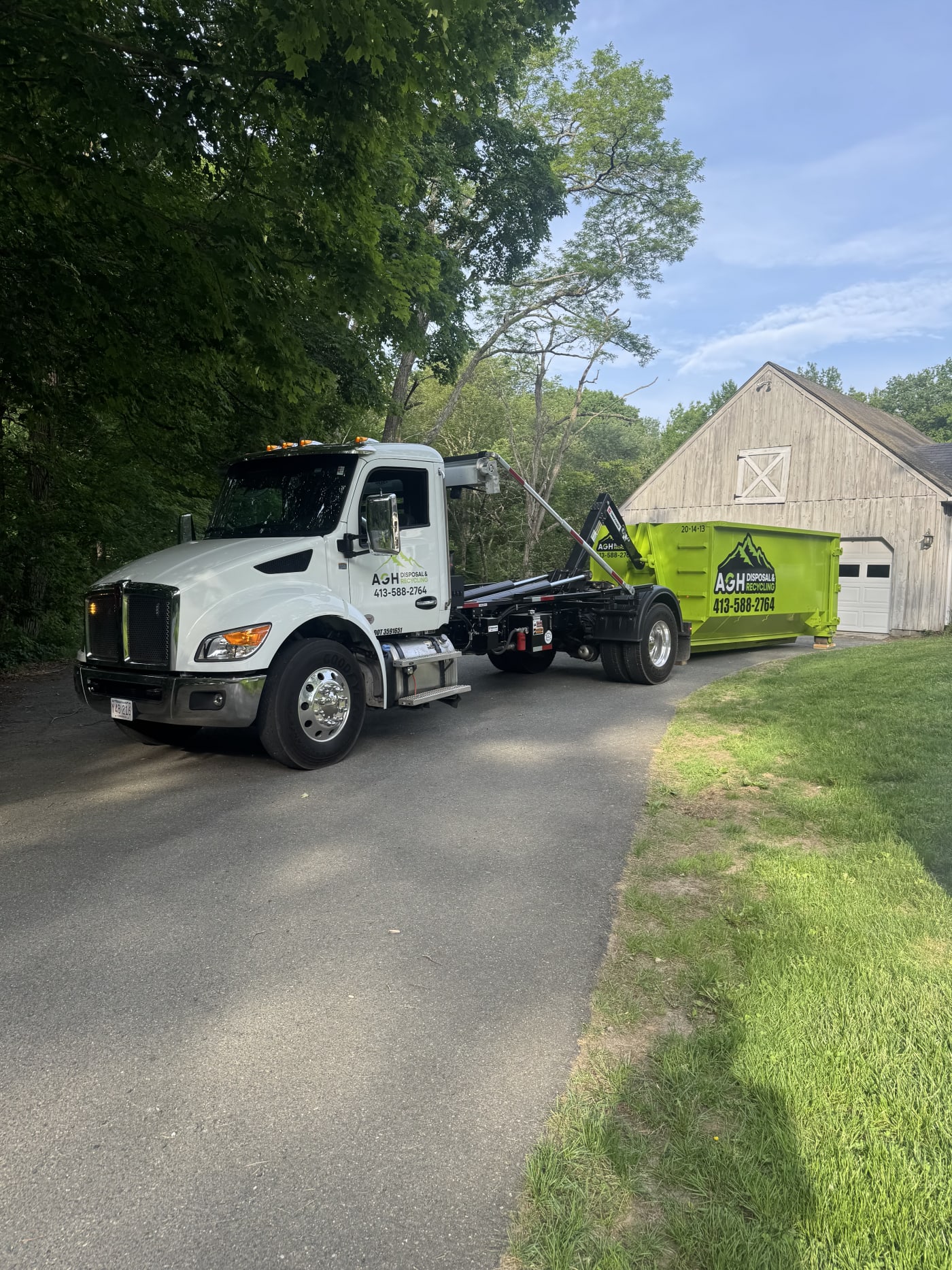 AGH truck and dumpster at a home in Northfield