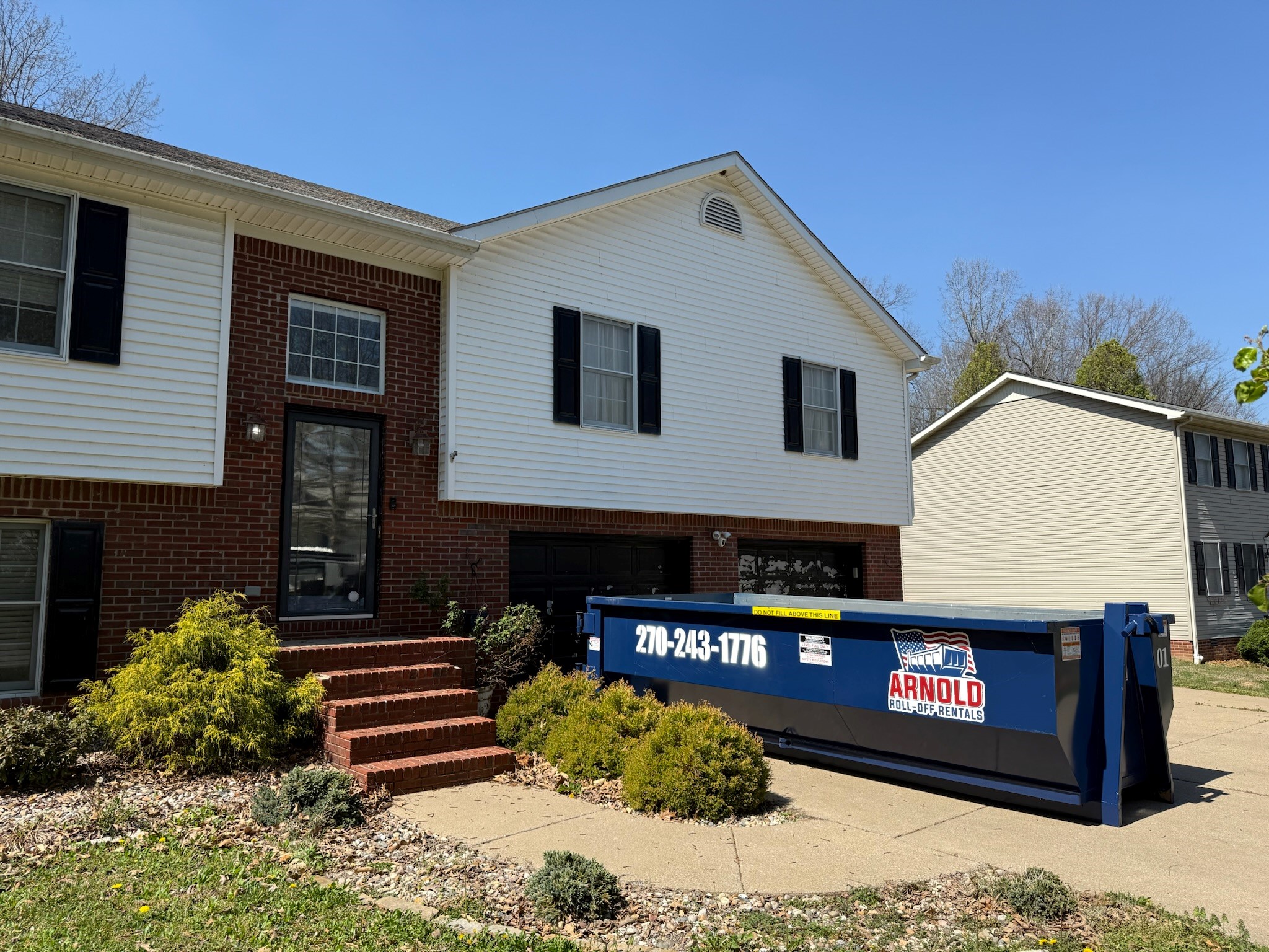 Arnold Roll Off Rentals roll-off dumpster delivered to a job site in Paducah KY