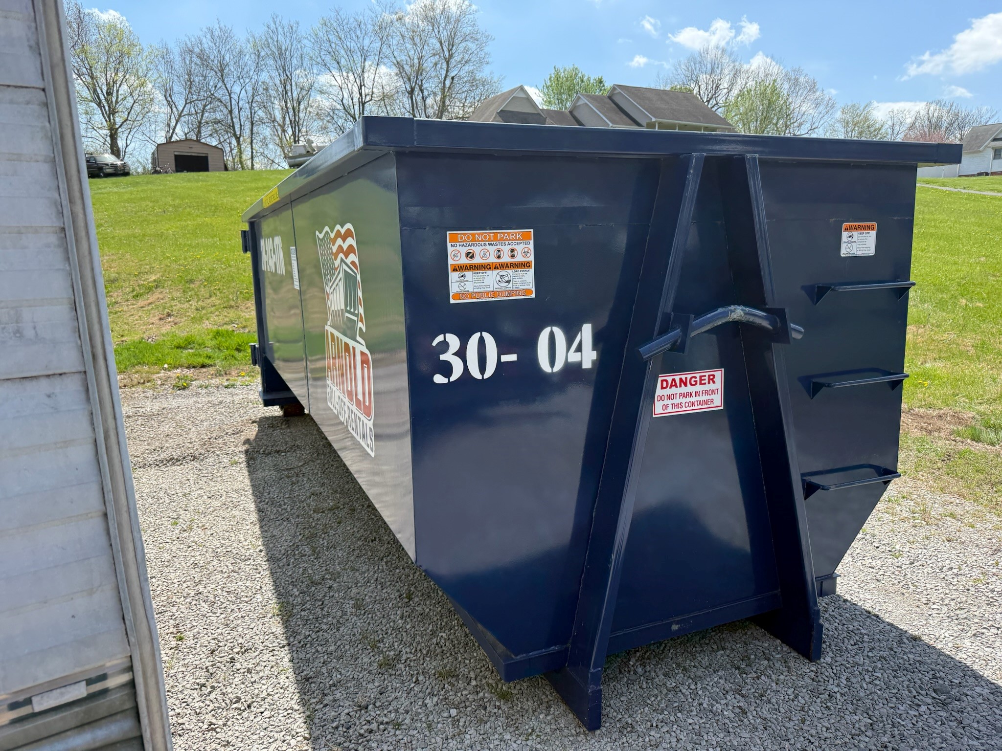 Arnold Roll Off Rentals truck delivering a dumpster in Paducah Kentucky