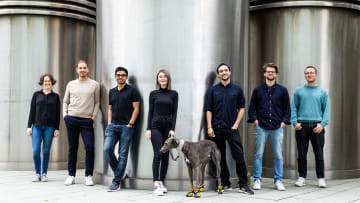 Heyflow team members and a greyhound standing outside casually