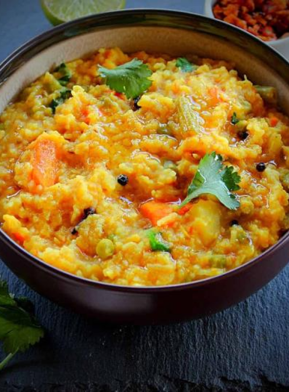 Moong Dal Khichdi is a complete meal in itself. Made with rice and lentils, khichdi is healthy, wholesome and a comfort food. This recipe is also gluten-free. It can be made vegan by replacing the ghee with oil.