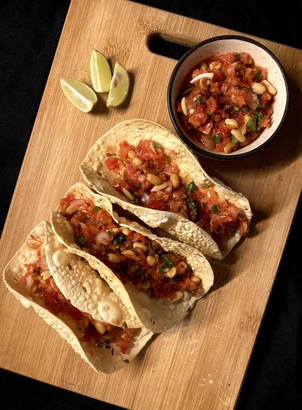 Masala Papad is a delicious Indian snack made using roasted or fried papad topped with a tangy and spicy onion tomato mix