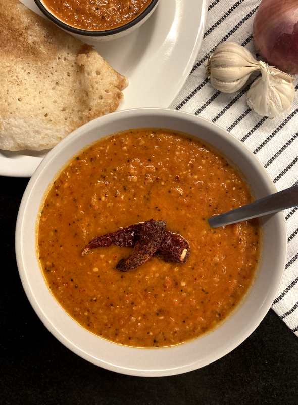 This is a spicy and tangy tomato onion chutney. Pairs well with savoury breakfast, snacks or even with plain rice