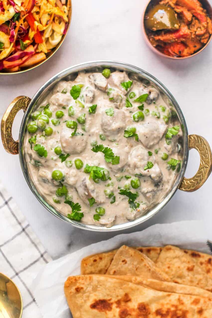 In contrast to the much-loved fiery and heavily spiced curries, there are lovely subtle and mild versions, one of which is Mushroom Matar Malai. Creamy, mildly spiced, with a touch of sweetness, Mushroom Matar Malai gets lightened up for a healthy weeknight staple. Pair with Roti/Paratha