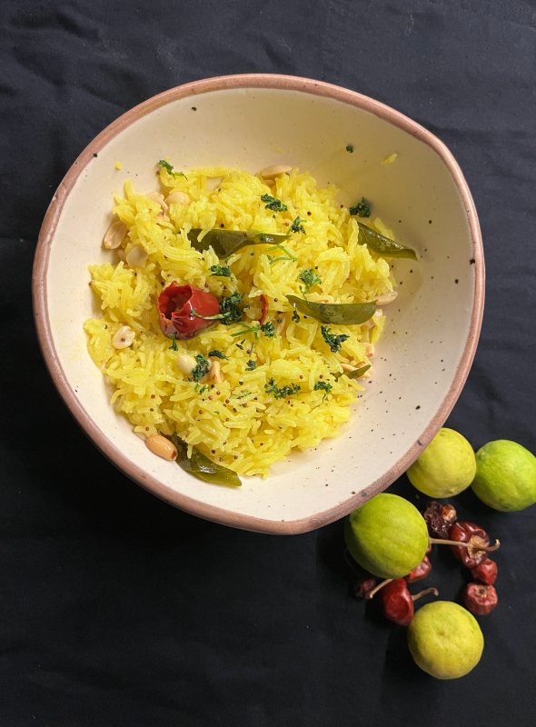 Lemon Rice also known as Chitranna or Nimmakaya Pulihora is a crunchy, flavorful, tasty, and tangy dish that is easy, using lemon juice, fried nuts, and spices combine perfectly to give this steamed rice an amazingly spicy, tangy, and nutty flavor. Pair with Curd