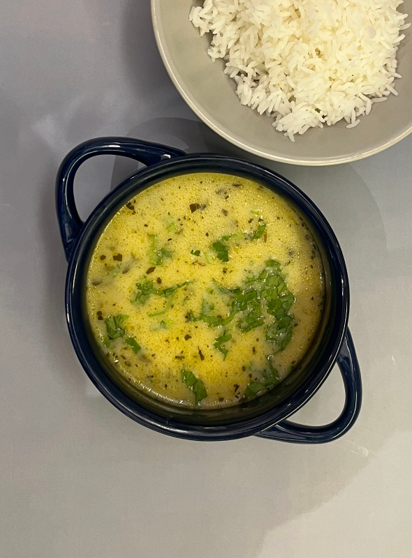Gujarati kadhi is a sweet tangy yogurt-based dish made with gram flour, spices, herbs, and seasonings. This easy variant of kadhi is made without gram flour fritters (pakoda). It makes for a quick comforting lunch or dinner. Pair with a side of steamed basmati rice or roti