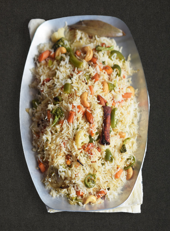 Bengali Ghee Bhath is a rich and flavorful rice dish made with ghee, whole spices, and aromatic basmati rice. The ghee adds a delicious nutty flavor and a luxurious mouthfeel, while the spices give the dish a warm and comforting aroma. It's a perfect side dish to serve with curries or enjoy on its own.