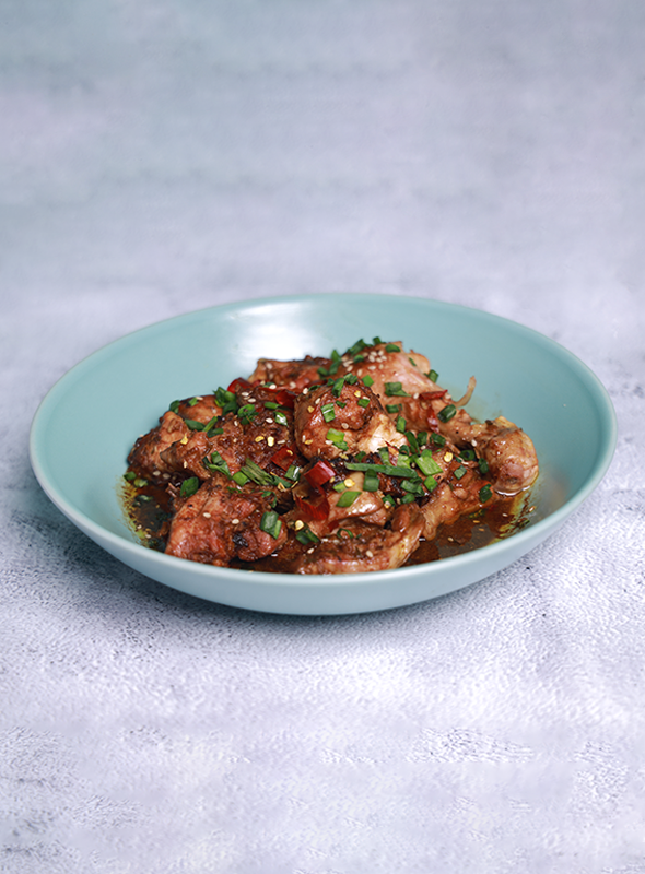 The Saucy Pepper Chicken with soy sauce, green onions, sesame, and sugar has a complex and flavorful taste profile. Combining these ingredients creates a delicious and satisfying dish that is both savory and slightly sweet, with a range of complementary flavors and textures. Pair with Noodles or Fried Rice