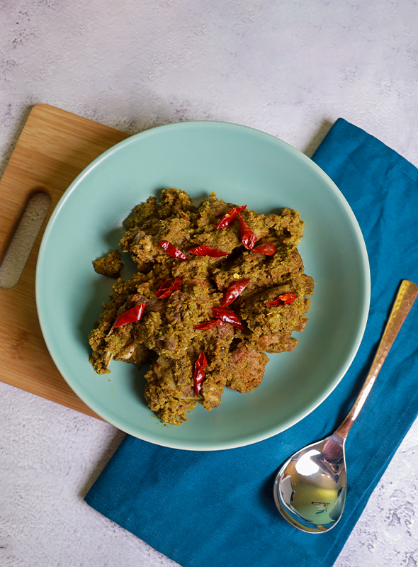 Satara special kharda mutton is a green masala recipe with fresh green chilies and coriander leaves. It's a dry dish, but can be made into gravy. The freshly ground masala adds a fantastic twist with spicy flavors. Garam masala can be skipped for a milder taste. Pair with Steamed Rice