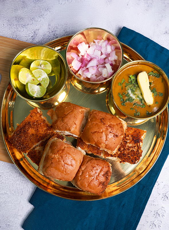 Hariyali Pav Bhaji is a delightful vegetarian street food dish from India, known for its vibrant green color and rich flavors. Made with a medley of mashed vegetables cooked in a spiced tomato-based gravy. This wholesome and delicious dish is perfect for satisfying your cravings and adding a burst of color to your plate! Pair with buttery Pav (buns)
