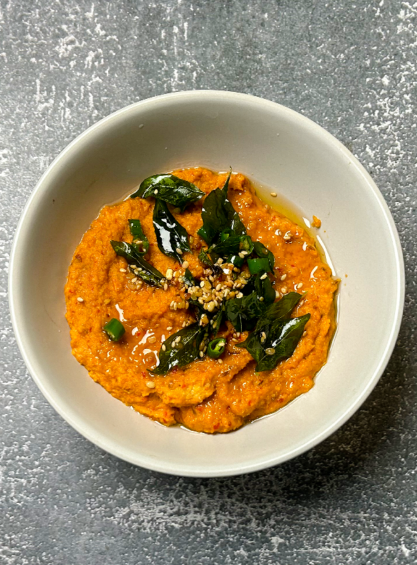 Tomato peanut chutney is a tangy and nutty condiment commonly found in South Indian cuisine. It is made by blending together fresh tomatoes, roasted peanuts, onions, and spices like cumin, chili powder, and garlic. This chutney can be served as a dip or spread for snacks, or as a side dish for rice and curry