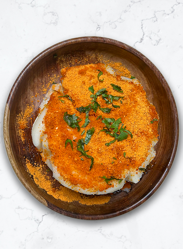 Thatte idli is a popular South Indian breakfast dish made with fermented rice and lentil batter. It is traditionally prepared using a special flat plate or mold to give it a unique and distinct shape. Thatte idli makes for a delightful and wholesome meal