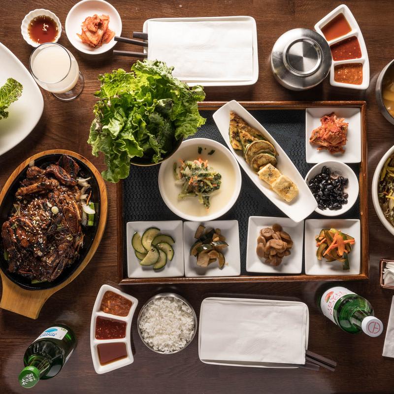 Fire up the grill—these spots serve smoky, sizzling meats with endless sides.