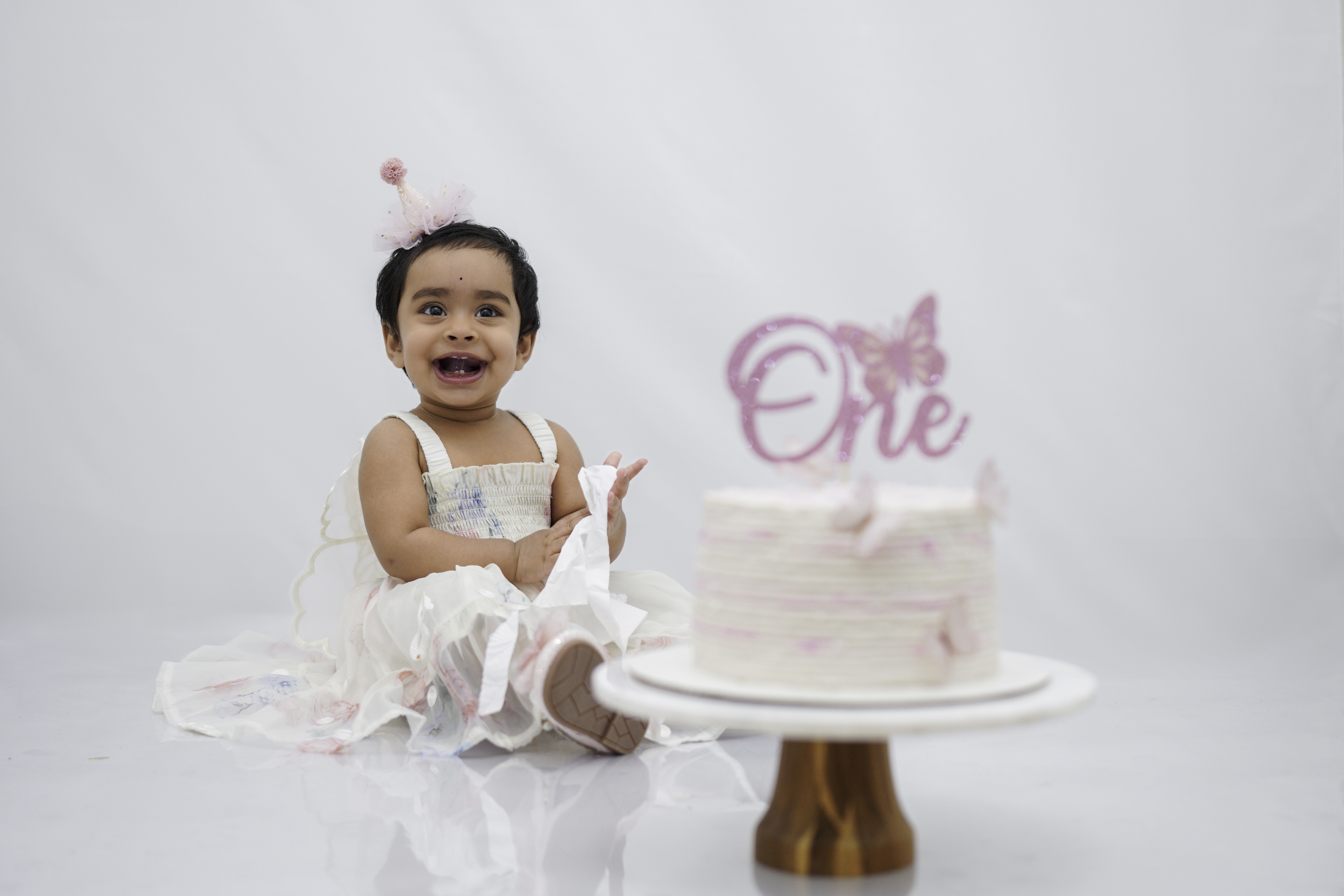 Baby sitting on a cushion