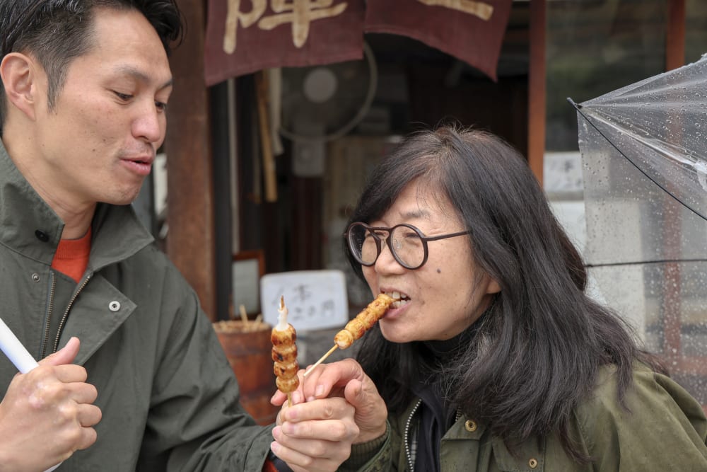 Guests tasting local specialties on a private Takayama food tour