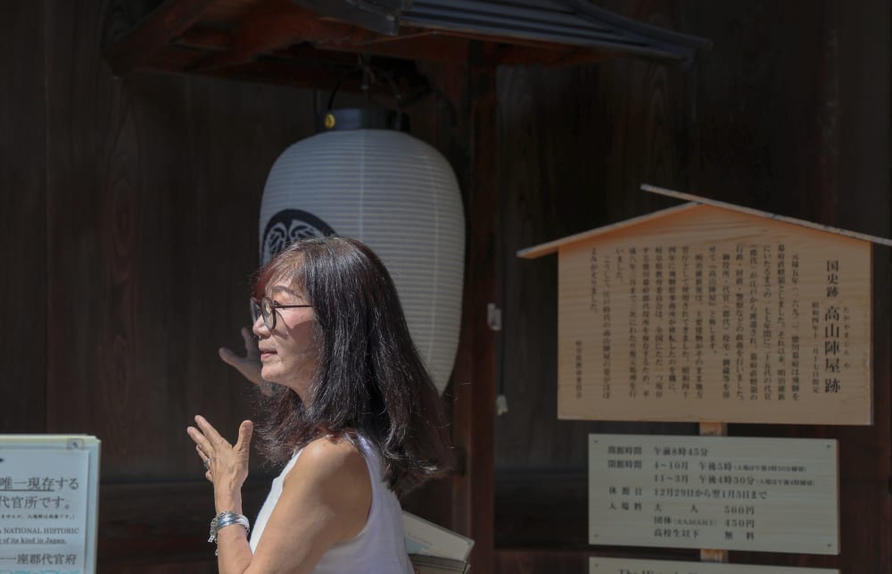 Wooden merchant houses lining a street in Takayama's Sanmachi Old Town