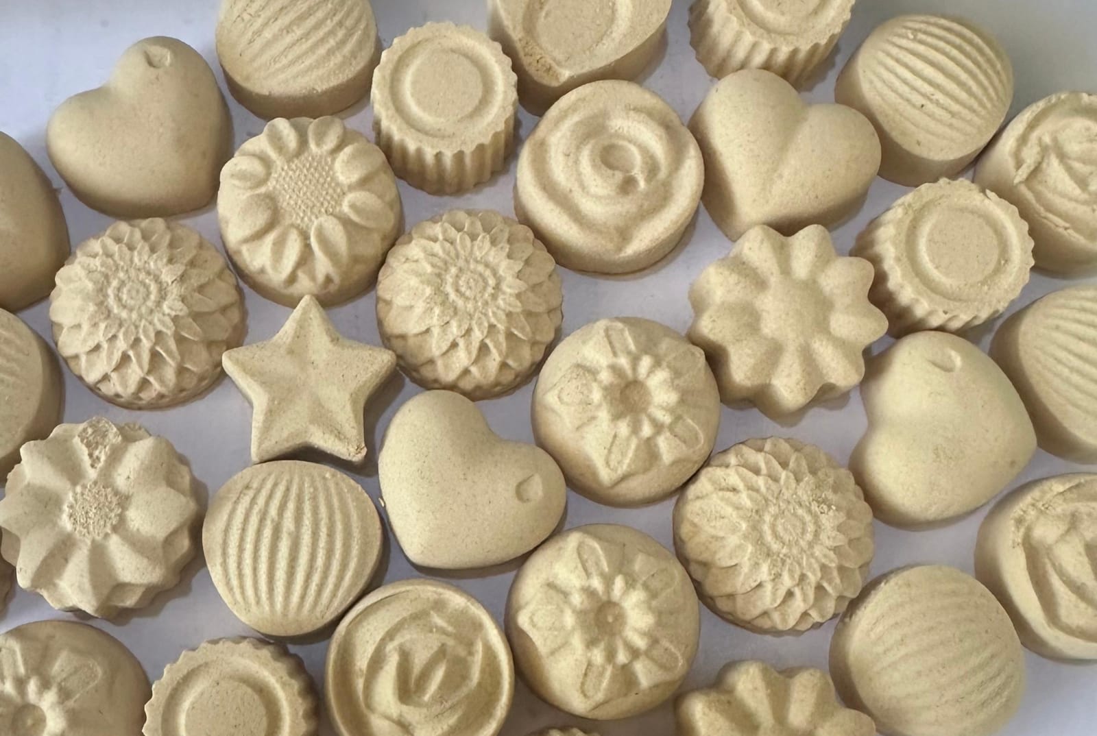 Heart-shaped baobab sweets arranged in an overhead product display