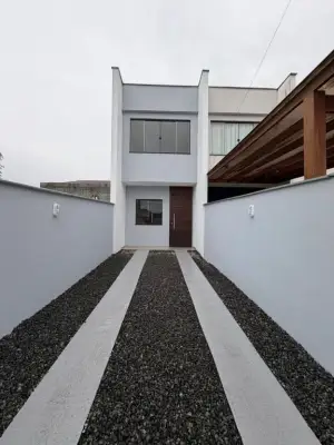 Sobrado geminado à venda em Joinville Vila Nova com churrasqueira e ambientes integrados