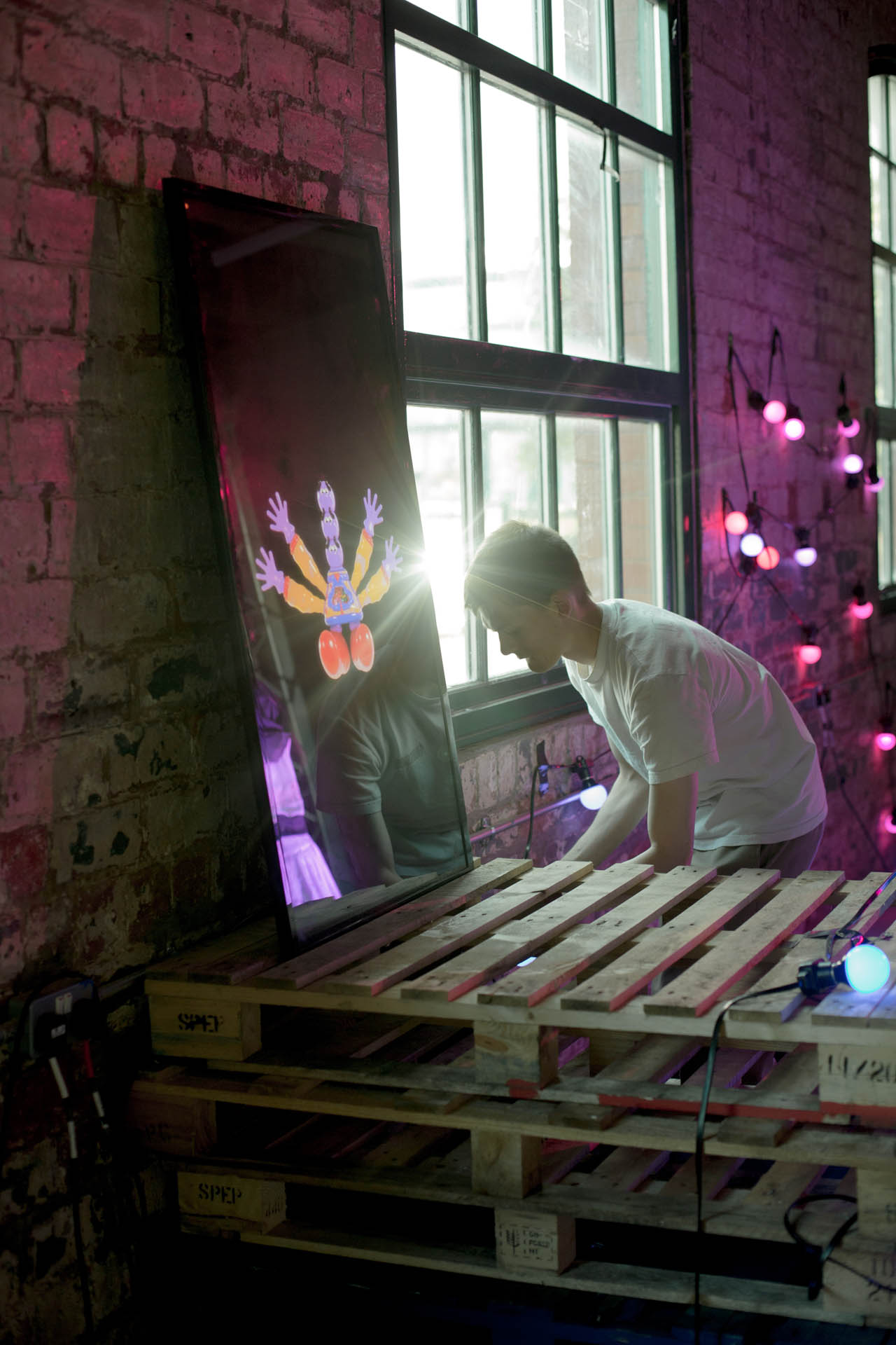 Man setting up lighting equipment