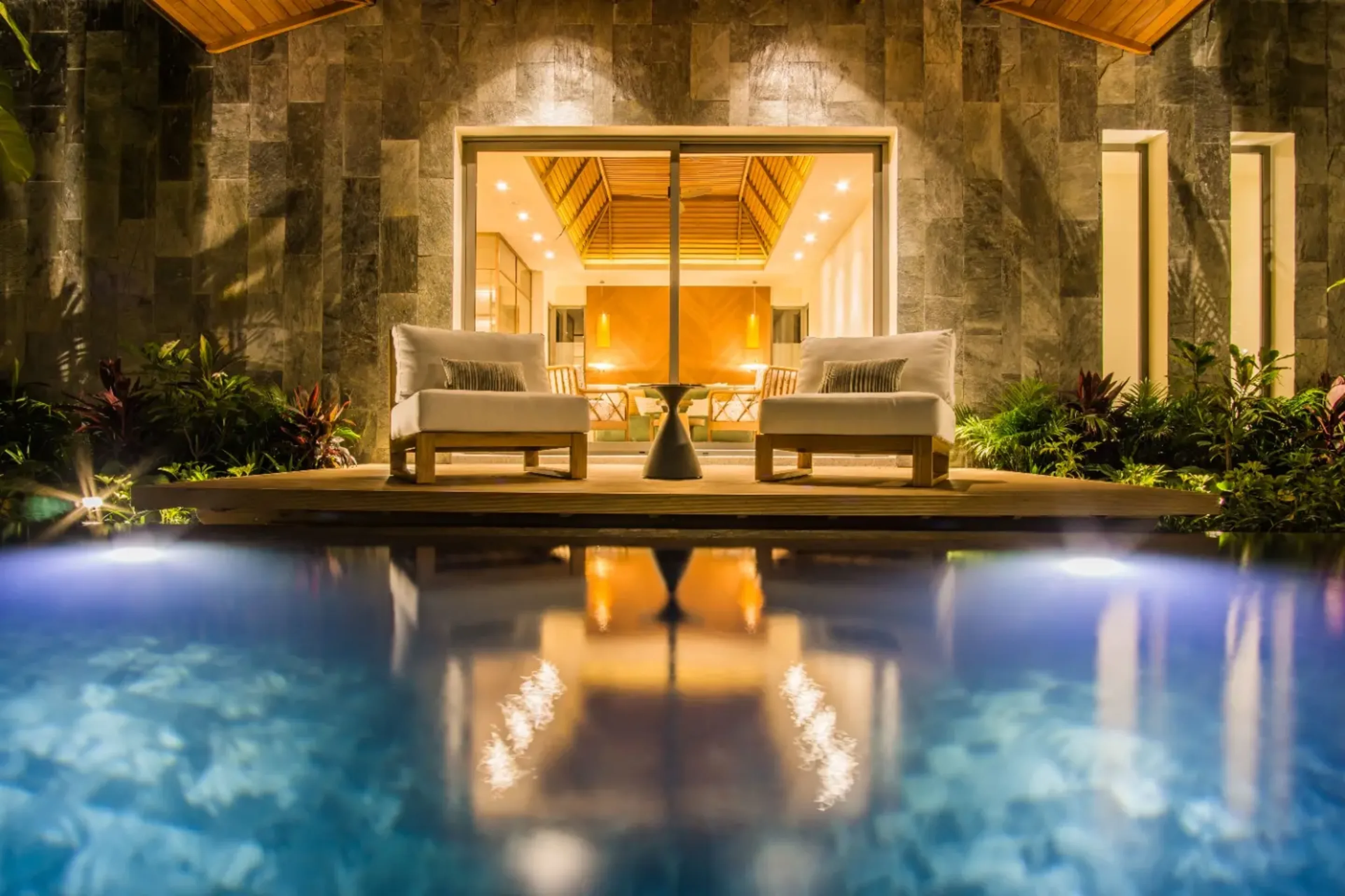 Contemporary pool villa in lush greenery