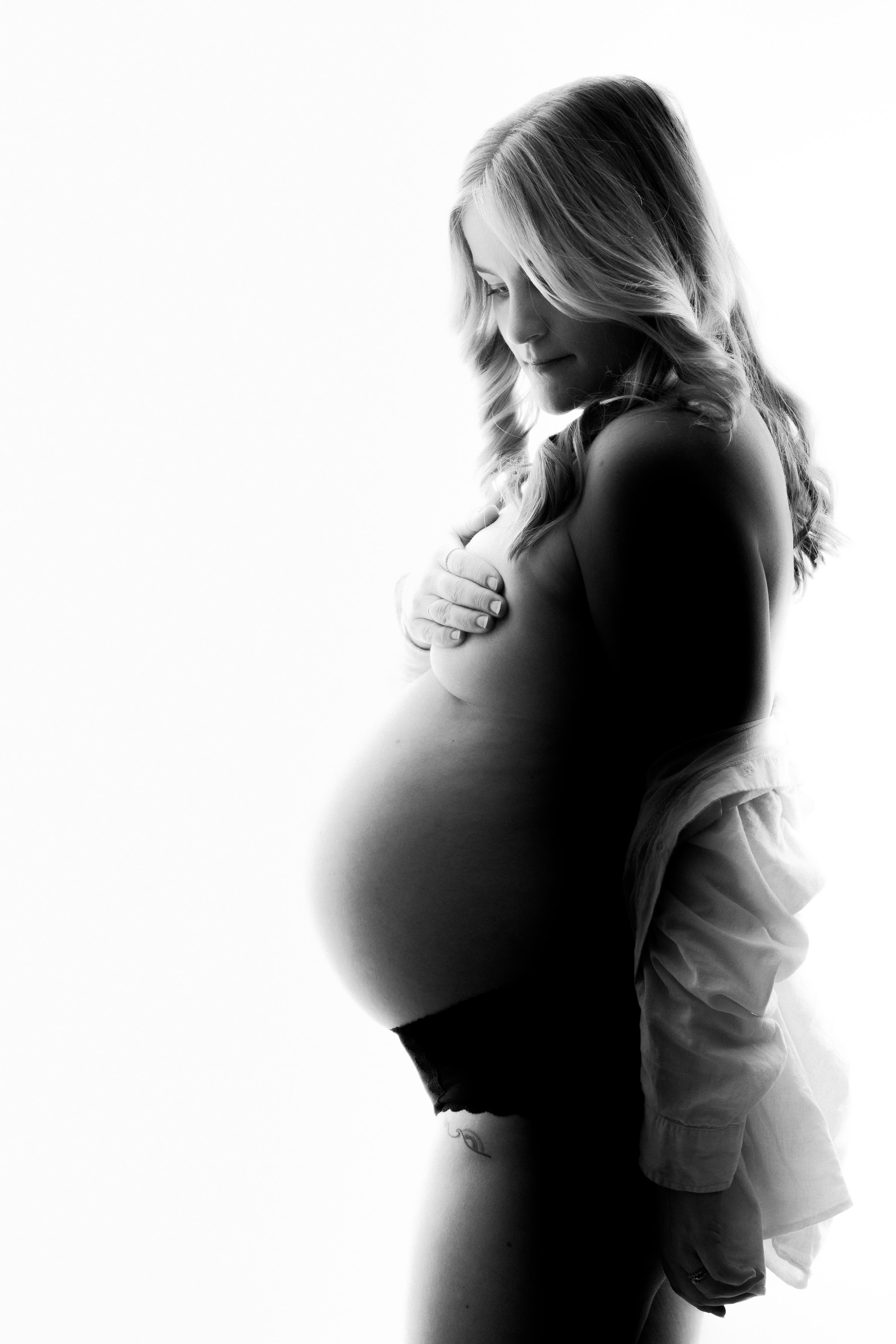 Okanagan maternity photography — atmospheric studio portrait with soft shadows