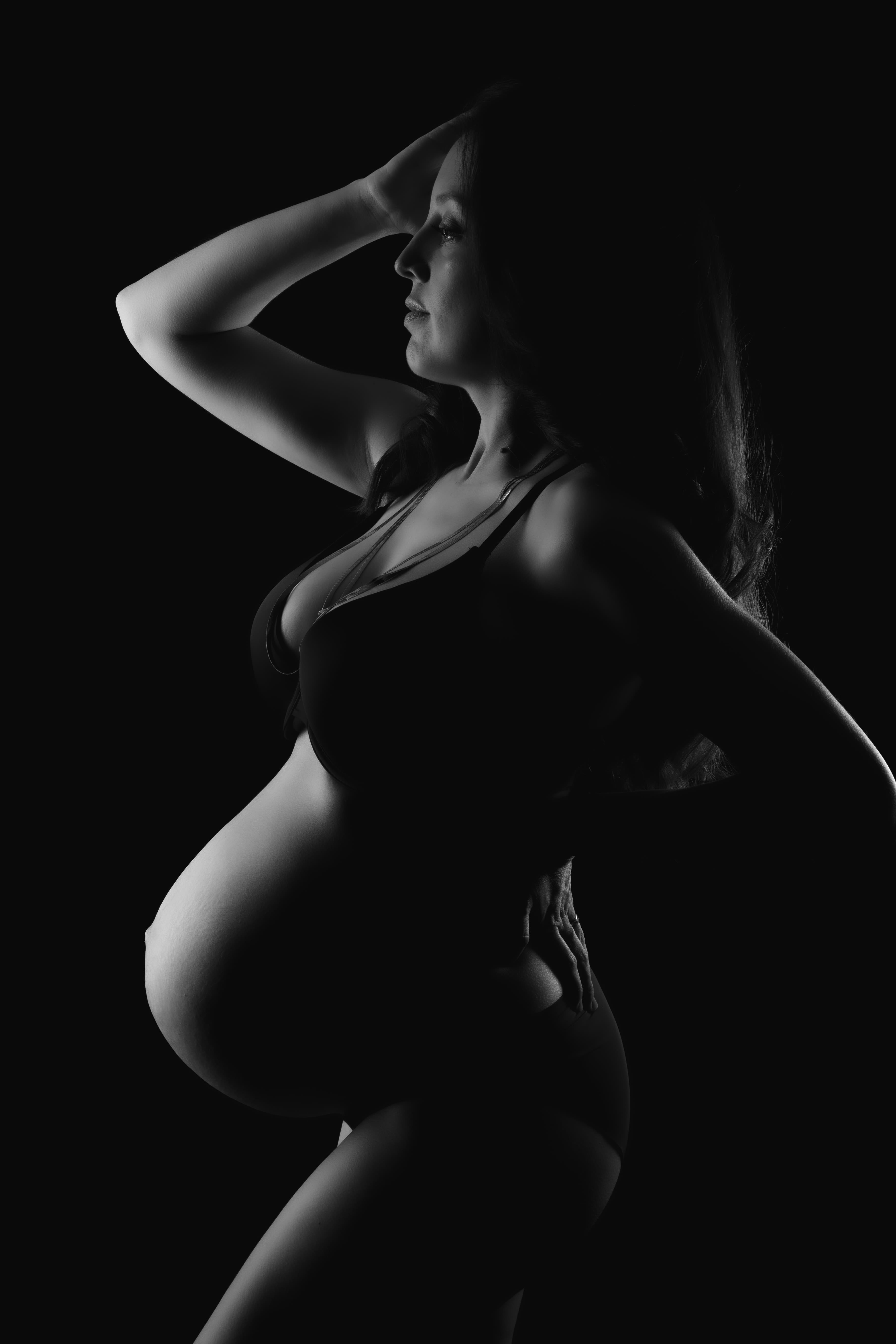 Okanagan maternity photography — atmospheric studio portrait with soft shadows
